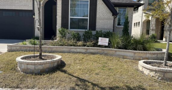 Stone work around trees and flower bed